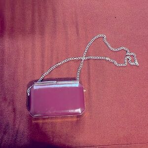 Small clutch with gold detachable chain